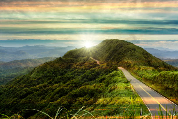 nice road with sunrise with colud and beautiful color THe nice road with sunrise with colud and beautiful color horizon over land stock pictures, royalty-free photos & images