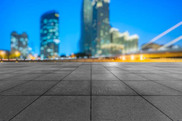 istock night view of empty brick floor front of modern building 1128579183