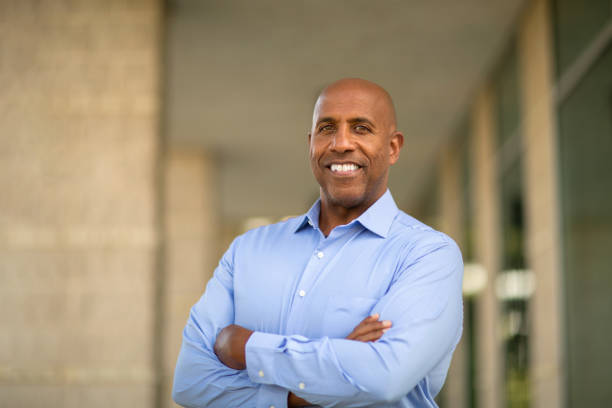 istock Happy mature African American man at work. 1128582562