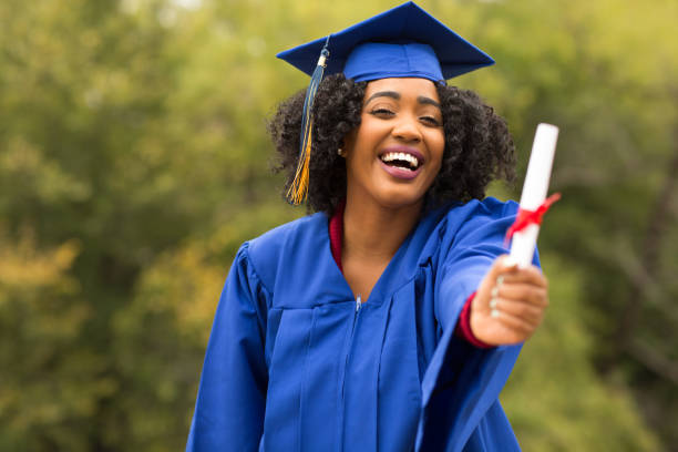 istock Excited young woman on graduation day. 1128583339