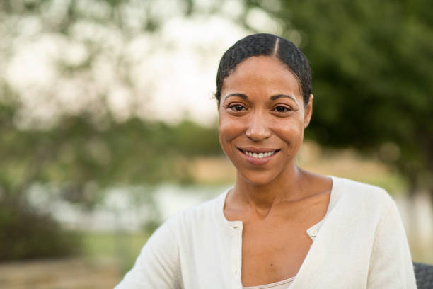 istock Confident diverse woman smiling with her arms crossed. 1128584848