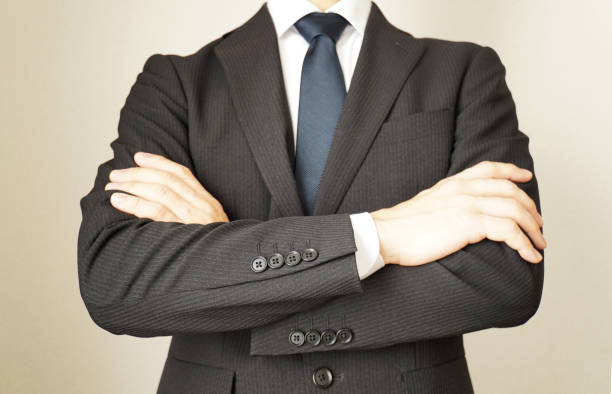 istock Businessmen with arms folded. 1128590327