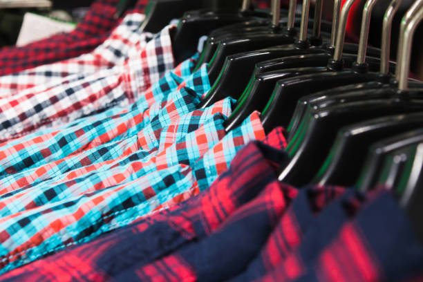 istock Colorful shirts on hanger in a shop 1128599941