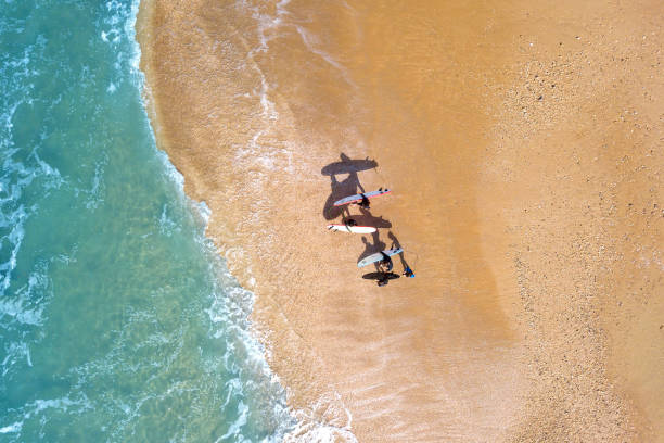 istock Small group of wave surfers and surf boards 1128604616