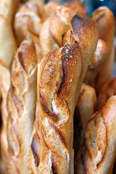 Fresh baguettes for sale at an outdoor market in Paris.