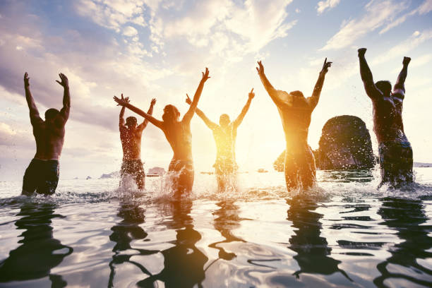 istock Group friends sea beach fun party 1128607954