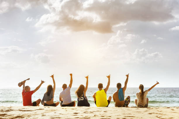 istock Group friends party sunset beach 1128608615
