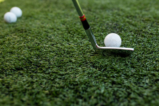 istock Golf stick and ball on green grass 1128609828