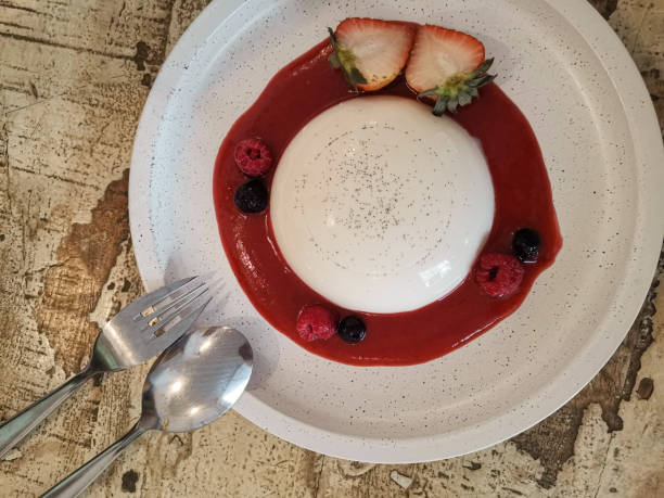 istock Strawberry panna cotta dessert serve with fruit 1128616094