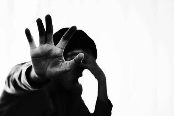 istock Depress and hopeless man under interrogate with lower head and stop hand 1128616761