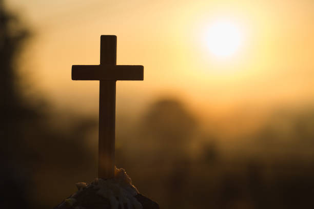 istock Christian wooden cross on a background with dramatic lighting,  Jesus Christ cross, Easter, resurrection concept. Christianity, Religion copyspace background. 1128619330