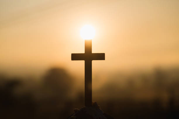 istock Christian wooden cross on a background with dramatic lighting,  Jesus Christ cross, Easter, resurrection concept. Christianity, Religion copyspace background. 1128619331