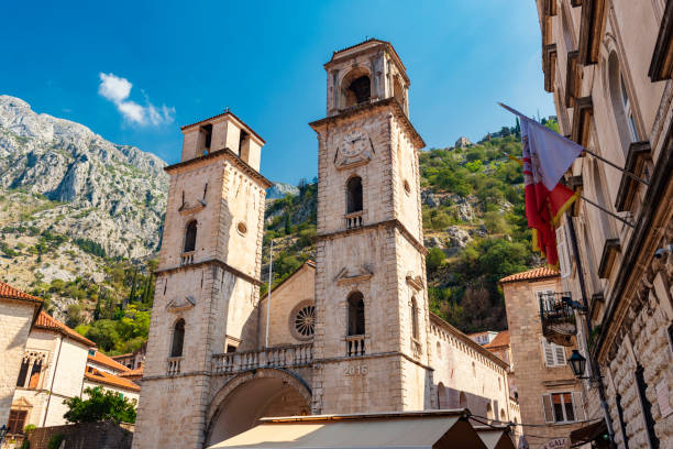 istock Cathedral of Saint Tryphon with bell and clock tower in Kotor, Montenegro 1128620332