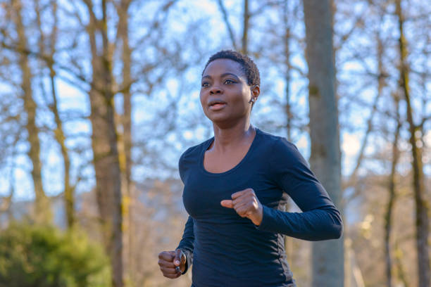 istock Determined young African woman training in a park 1128620621