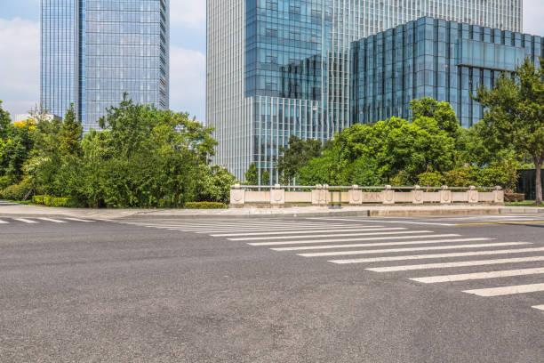 istock Empty urban road and modern buildings 1128621704