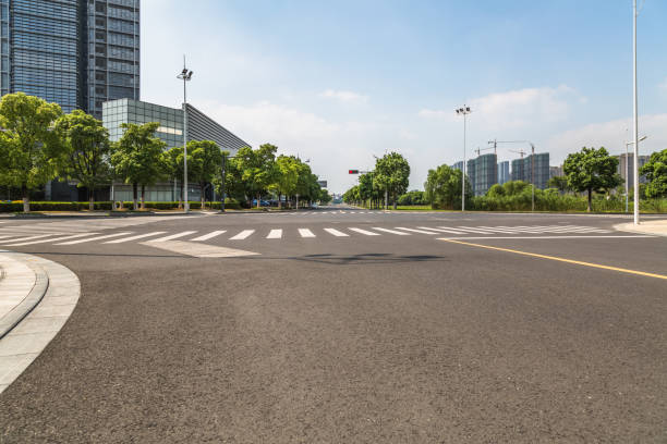 istock empty asphalt road front of modern buildings 1128621724
