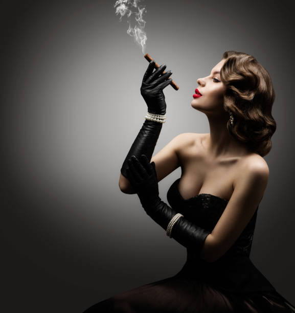 Retro Woman Smoking Cigar, Fashion Model Old Fashioned Beauty Portrait Retro Woman Smoking Cigar, Fashion Model Old Fashioned Beauty Portrait over Gray Background smoking women luxury cigar stock pictures, royalty-free photos & images