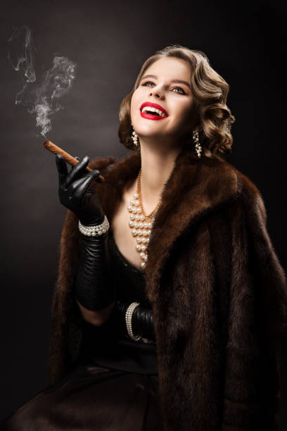 Retro Woman Smoking Cigar, Fashion Model Luxury Beauty Portrait n Fur Coat Retro Woman Smoking Cigar, Happy Fashion Model Luxury Beauty Portrait, Beautiful Girl in Fur Coat Pearl Jewelry smoking women luxury cigar stock pictures, royalty-free photos & images