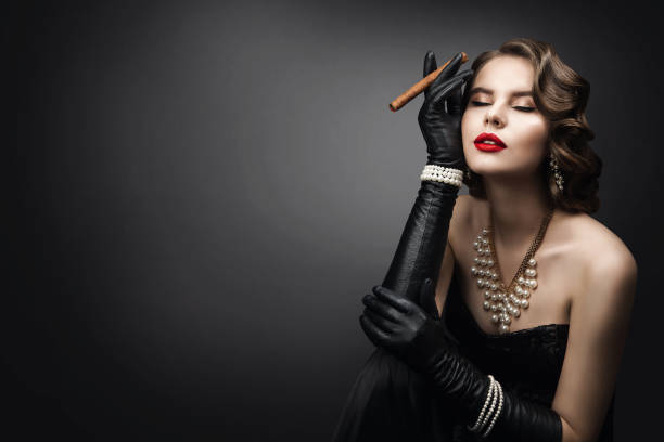 Retro Woman Smoking Cigar, Fashion Model Beauty Portrait, Old Fashioned Girl Retro Woman Smoking Cigar, Fashion Model Beauty Portrait, Old Fashioned Girl Dreaming over Gray Background smoking women luxury cigar stock pictures, royalty-free photos & images