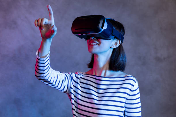 istock Attractive asian girl with VR goggles on head 1128626667
