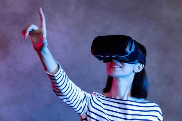 istock Attractive asian girl with VR goggles on head 1128626681
