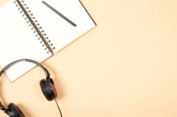 istock Home office workspace for blogging with notebook and headphones. 1128629362