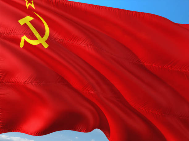 istock Flag of Soviet Union waving in the wind against deep blue sky. High quality fabric. 1128629607