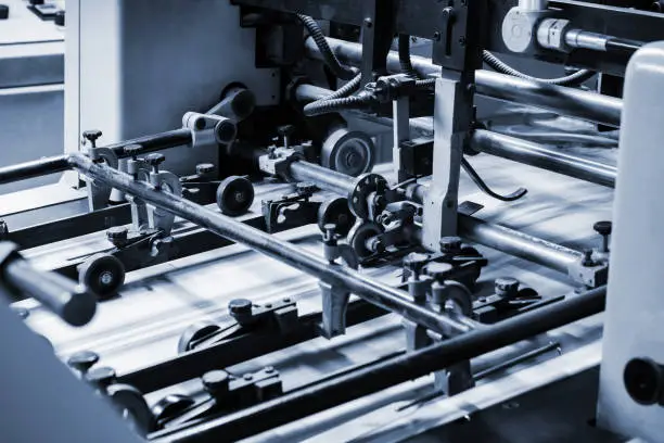 Photo of printing leaflets in a modern printing house