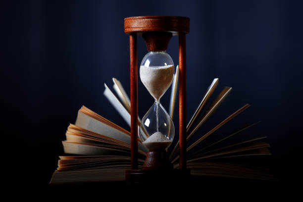 istock Book and an hourglass 1128634303