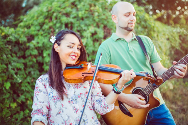 istock Musicians with guitar and violin 1128634325