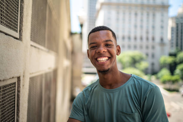 istock Afro young man in the city portrait 1128635680
