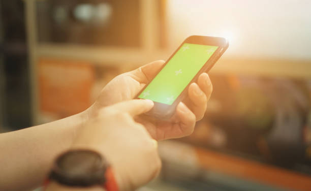 istock Young man waiting on station platform on background moving train using smart phone.with IOT, internet of things,smart city and network connect concept 1128636095