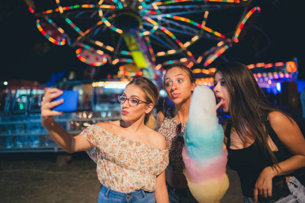istock Girls taking selfies with cotton candy 1128638377