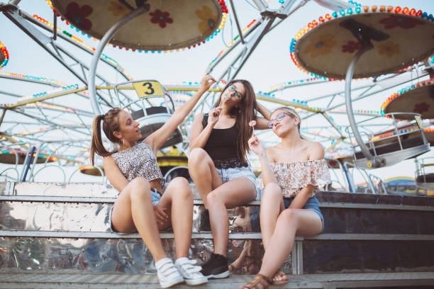 istock Girls fooling around with lollipops 1128639724