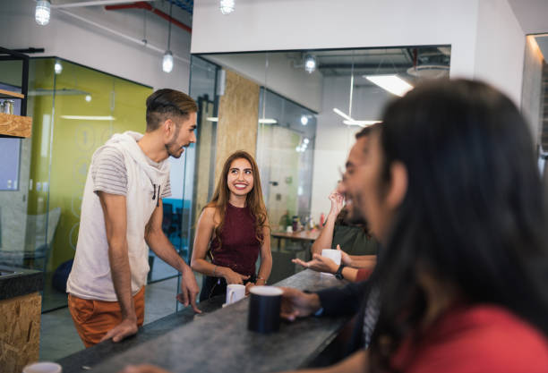 istock Group of young Latin millennials developing start-up project and having a coffee break together 1128639838