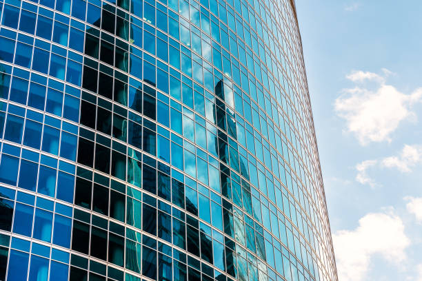 istock Sky and buildings are reflected in the office skyscraper facade 1128639935