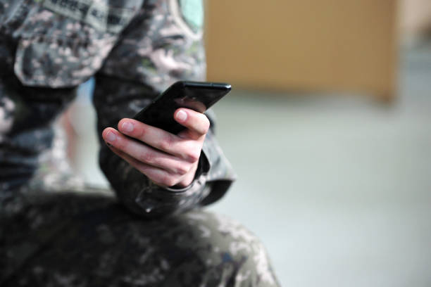 South Korean Army Soldier Using Smartphones. stock photo
