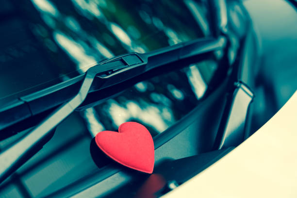 istock Steering wheel with heart red object.Love car concept idea.interior console car. 1128645447
