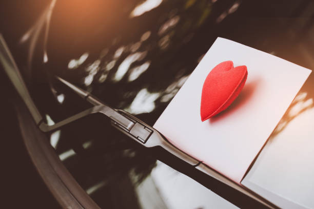 istock love letter heart on a sticky note under a windshield .vintage  color style 1128646041