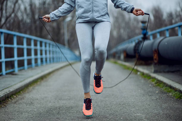 Unrecognizable Sportswoman Jumping Rope On A Bridge Stock Photo - Download  Image Now - iStock