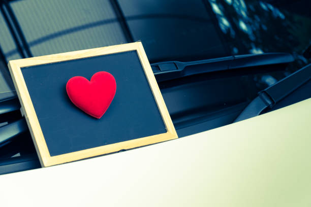 istock love letter heart on a sticky note under a windshield .vintage  color style 1128646100