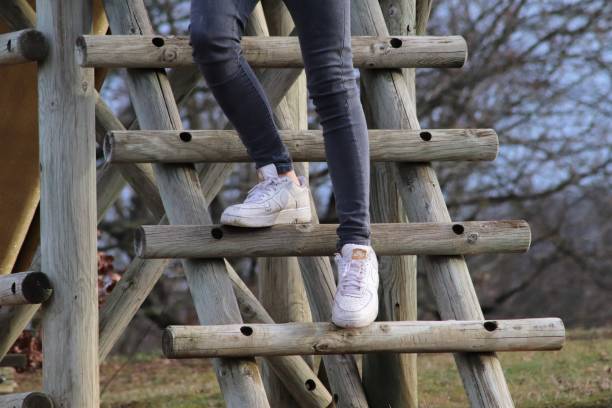 istock YOUNG DESCENDANT A WOODEN LADDER 1128652099