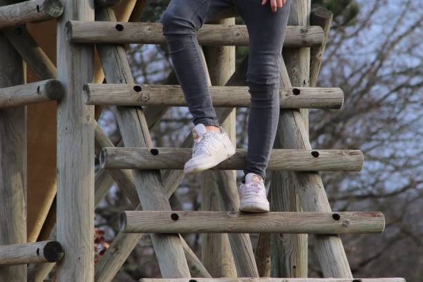 istock YOUNG DESCENDANT A WOODEN LADDER 1128652104