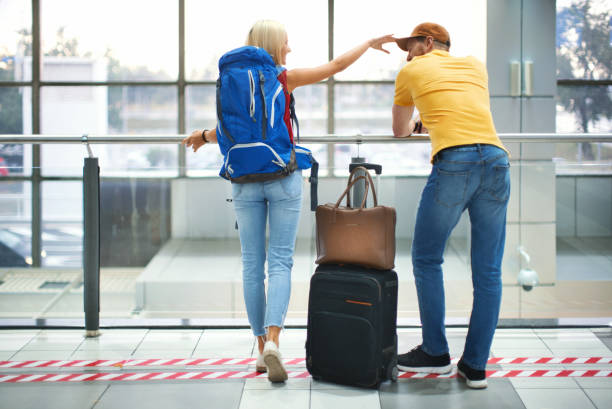istock Young couple at an airport. 1128652771