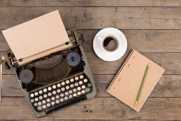 istock Vintage typewriter on the old wooden desk 1128655656