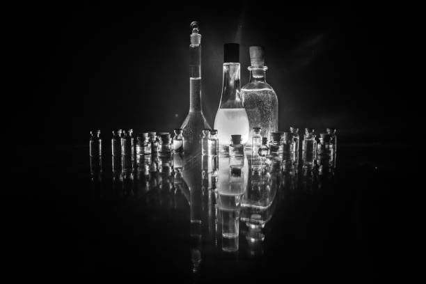 istock Pharmacy and chemistry theme. Test glass flask with solution in research laboratory. Science and medical background. Laboratory test tubes on dark toned background 1128657102