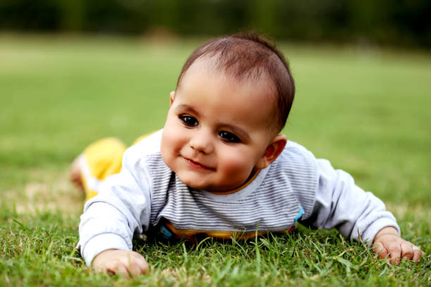 istock Baby boy crawling in the nature 1128658450