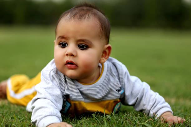 istock Baby boy crawling in the nature 1128658453