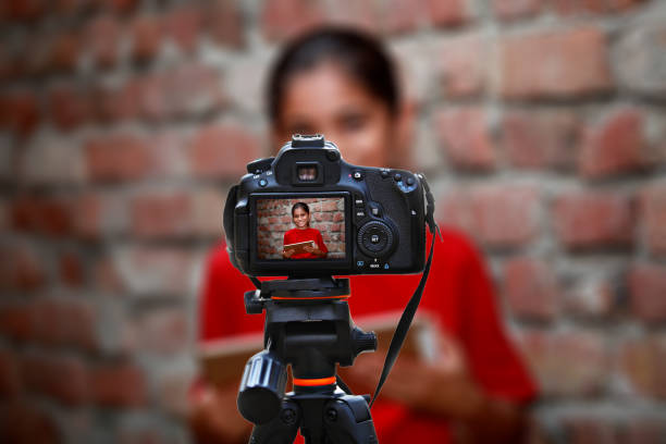 istock Cute little girl of Indian ethnicity using digital tablet at home 1128658564