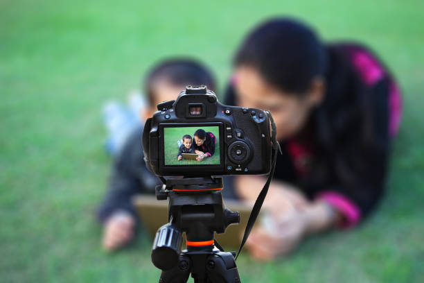 istock Mother & child using digital tablet outdoor in the field 1128658584
